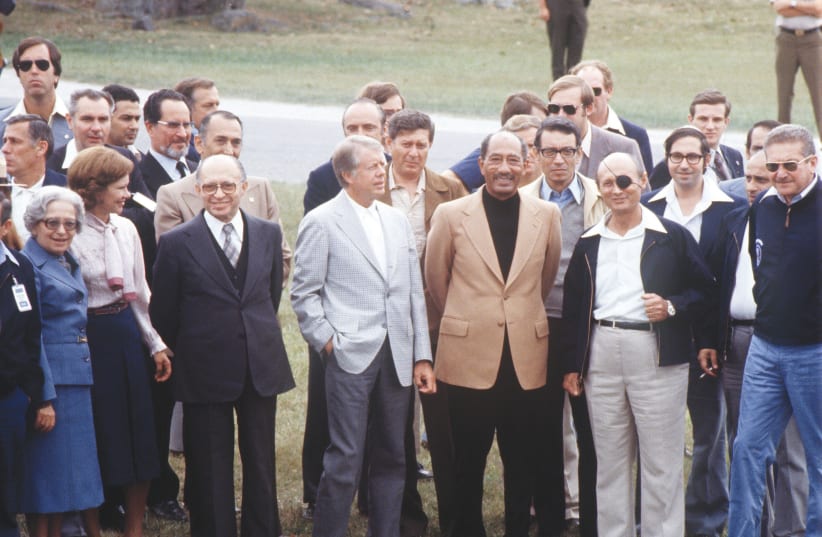 Once upon a time things were different. From Right - Ezer Weizman, Moshe Dayan, Anwar al-Sadat, Jimmy Carter and Menachem Begin at theas they walk in Gettysburg during the Camp David Israeli-Egyptian peace negotiations in 1978. (photo credit: AFP VIA GETTY IMAGES)
