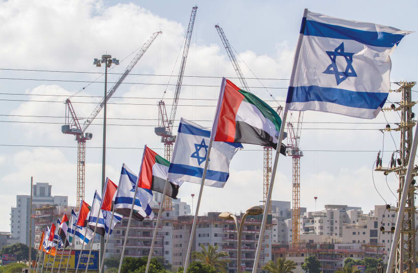 ISRAELI AND UNITED Arab Emirates flags can be seen on a road in Netanya this week. (photo credit: FLASH90)