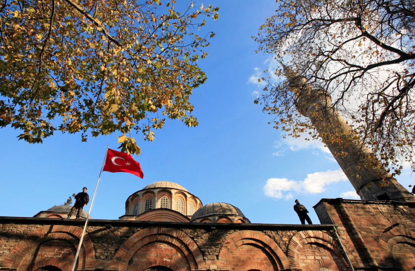 Turkish police officers stand guard on the top of the Kariye (Chora) museum in Istanbul (photo credit: REUTERS)