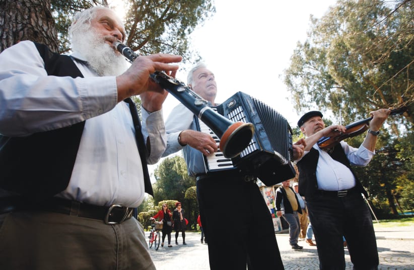 JEWISH MUSICIANS perform in the streets of Tirana, Albania, in preparation for Passover. (photo credit: ARBEN CELI/REUTERS)