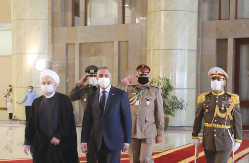 IRANIAN PRESIDENT Hassan Rouhani welcomes Iraqi Prime Minister Mustafa al-Kadhimi, to Tehran, last month.  (photo credit: REUTERS)