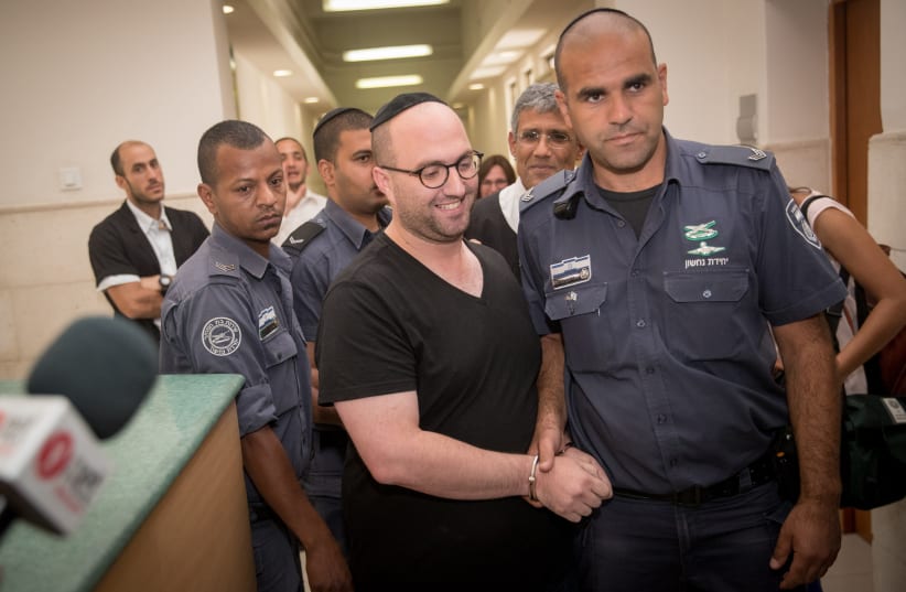 Mati Ben David is brought to the Jerusalem District Court In Jerusalem on July 2, 2017 (photo credit: YONATAN SINDEL/FLASH90)