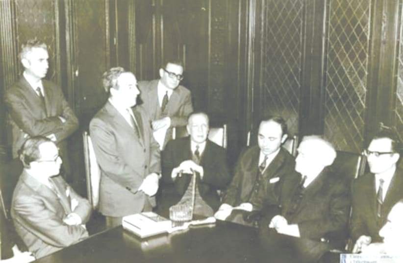 DAVID BEN-GURION meets in Buenos Aires with Baruch Tenembaum and Jorge Luis Borges to his right. (photo credit: MARC TURKOW CENTER/AMIA)