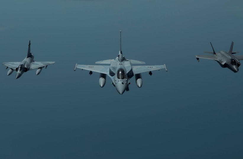 A United Arab Emirates Air Force Mirage 2000 (L), UAE F-16 Desert Falcon (C) and a U.S. F-35A Lightning II (R) fly a partnering flight in the U.S. Central Command area of responsibility, in the Arabian Gulf, May 29, 2019 (photo credit: CHRIS DRZAZGOWSKI/U.S. NAVY/HANDOUT VIA REUTERS)