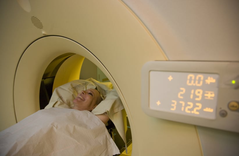 A woman with breast cancer is receives a CT scan on June 18, 2012.  (photo credit: CHEN LEOPOLD/FLASH90)