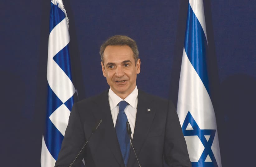 GREEK PRIME MINISTER Kyriakos Mitsotakis speaks during a joint press briefing with Prime Minister Benjamin Netanyahu in Jerusalem, June 2020  (photo credit: DEBBIE HILL/REUTERS)