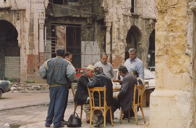 MEN PLAY chess in downtown Beirut in front of a crumbling Ottoman villa, September 1992 (photo credit: HADANI DITMARS)