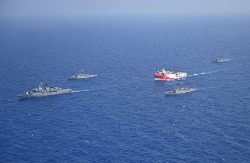 Turkish seismic research vessel Oruc Reis is escorted by Turkish Navy ships as it sets sail in the Mediterranean Sea, off Antalya, Turkey, August 10, 2020. (photo credit: TURKISH DEFENCE MINISTRY/HANDOUT VIA REUTERS)