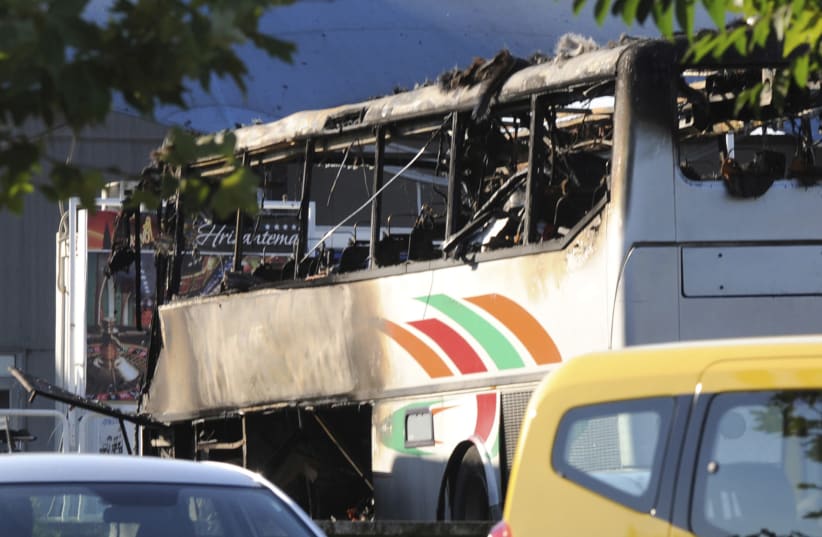 A burnt bus is seen at Bulgaria's Burgas airport July 18, 2012. Three people were killed and over 20 injured by an explosion on a bus carrying Israeli tourists outside the airport of the Black Sea city of Burgas. (photo credit: REUTERS/STRINGER)