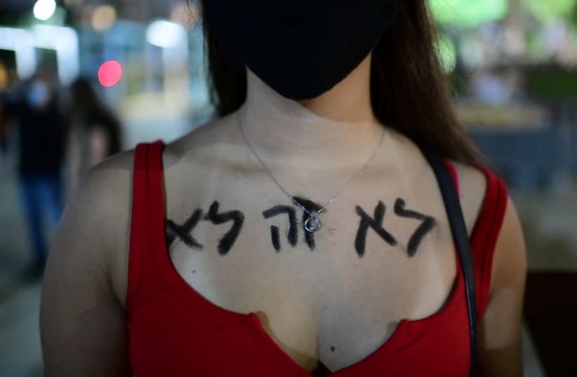 Israelis take part in a demonstration in support of the 16 year old victim of a gang rape in Eilat a few days ago, in Tel Aviv. August 22, 2020 (photo credit: TOMER NEUBERG/FLASH90)