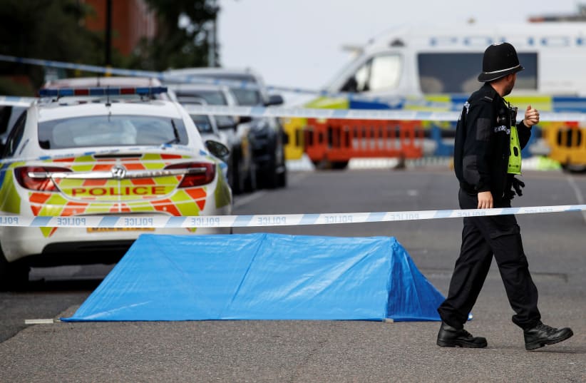 A police officer is seen near the scene of reported stabbings in Birmingham, Britain, September 6, 2020 (photo credit: REUTERS/PHIL NOBLE)