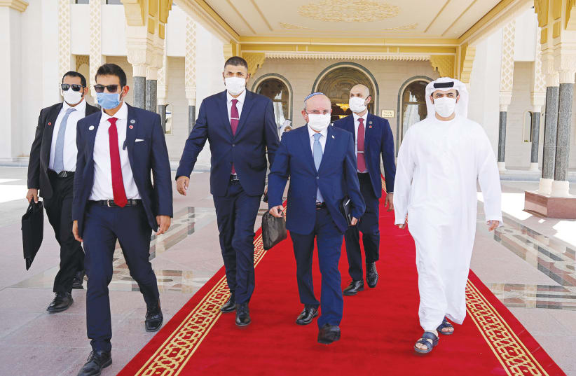 NATIONAL SECURITY ADVISER Meir Ben-Shabbat (fourth right) makes his way to board a plane to leave Abu Dhabi last week. (photo credit: REUTERS)