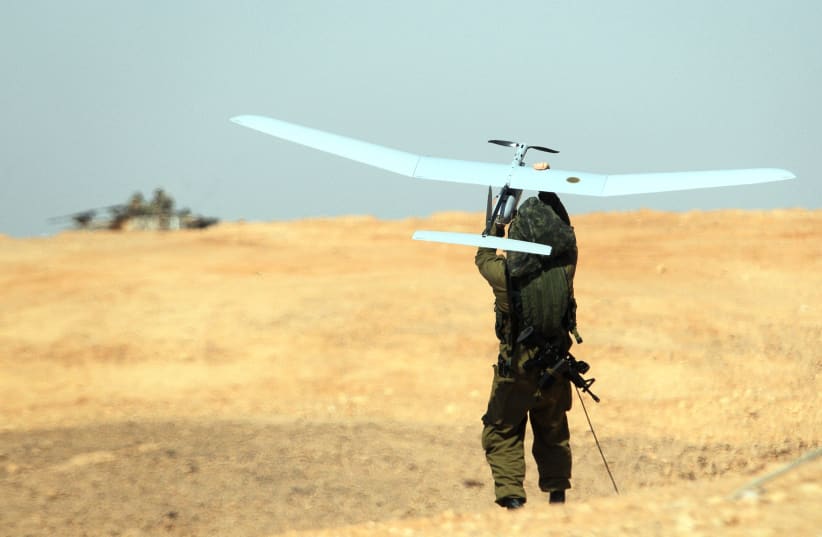 A SKYLARK drone is thrown by an IDF soldier during a military exercise in southern Israel in 2013 (photo credit: IDF SPOKESPERSON'S UNIT)