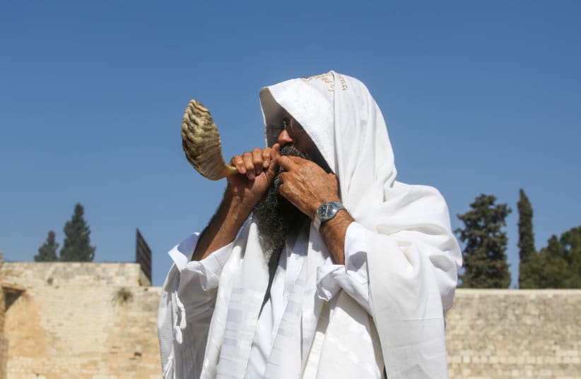 A man blowing the shofar at the Western Wall days before Rosh Hashanah (photo credit: MARC ISRAEL SELLEM)