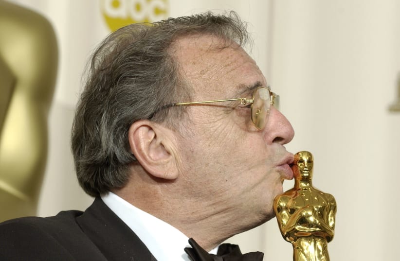 Writer Ronald Harwood kisses the best adapted screenplay Oscar for his movie "The Pianist" at the 75th Annual Academy Awards at the Kodak Theatre in Hollywood, California, March 23, 2003 (photo credit: REUTERS)