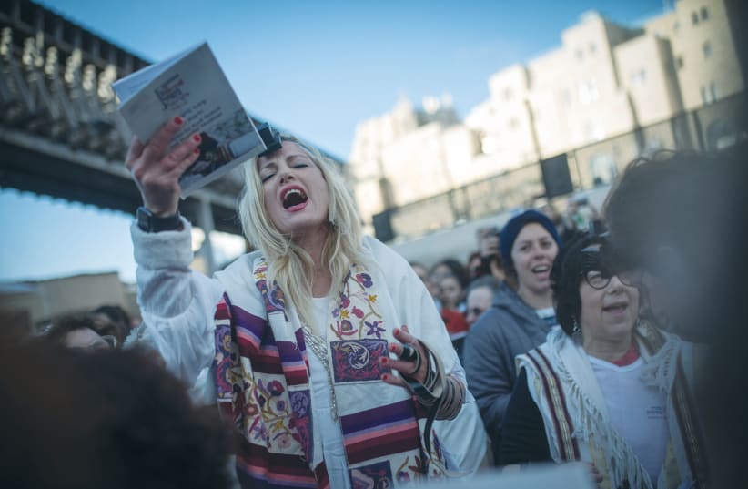 CALLING THEMSELVES ‘Women of the Wall,’ they turn up at the beginning of each Jewish month for morning prayers, not to pray quietly alongside other women, but to begin a loud communal service with their own leader chanting the prayers and disturbing the devotion in that relatively small area. (photo credit: HADAS PARUSH/FLASH90)