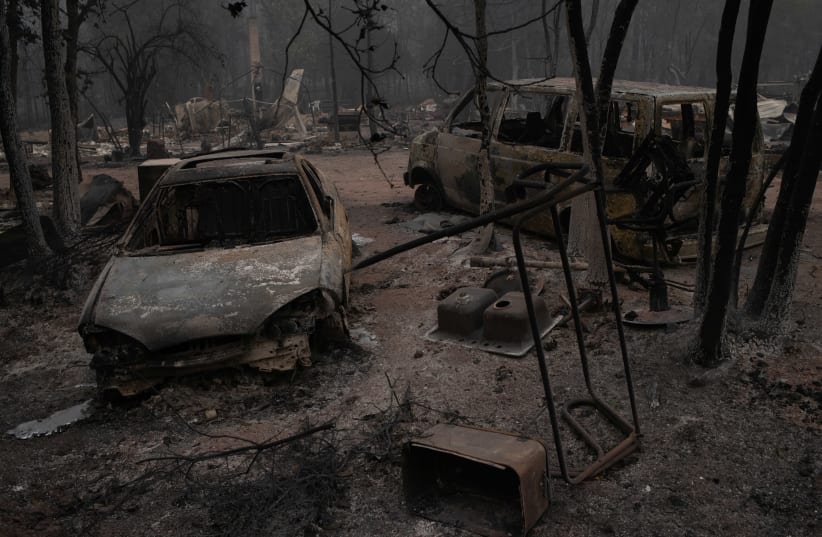 Vehicles lie damaged in the aftermath of the Obenchain Fire in Eagle Point, Oregon, US, September 11, 2020. (photo credit: ADREES LATIF/REUTERS)