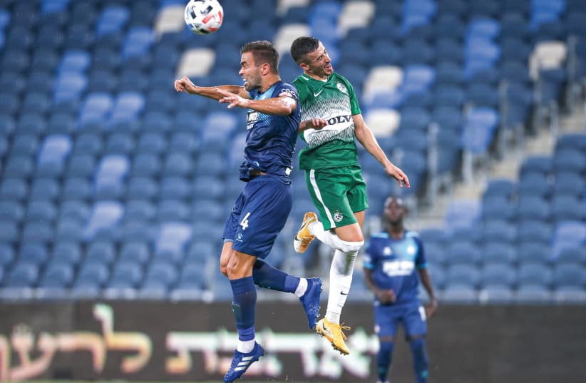MACCABI HAIFA and Hapoel Beersheba (in blue) battled in front of empty stands at Sammy Ofer Stadium on Sunday night, with the Greens emerging with a 3-1 home victory in Israel Premier League Round 2 action. (photo credit: MAOR ELKASLASI)