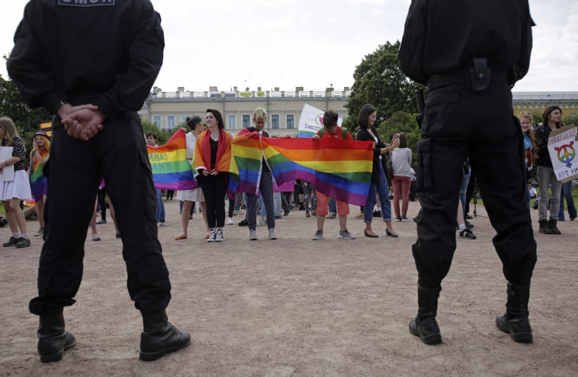 Interior Ministry officers guard an LGBTQ+ community rally "VIII St.Petersburg Pride" in St. Petersburg, Russia August 12, 2017. (photo credit: ANTON VAGANOV/ REUTERS)