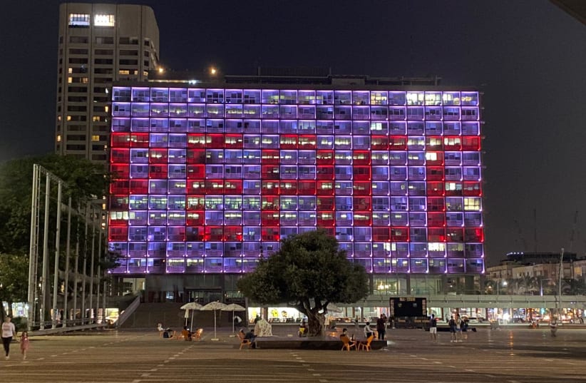 The word "Peace" as seen on the facade of the Tel Aviv Municipality building (photo credit: COURTESY TEL AVIV MUNICIPALITY)