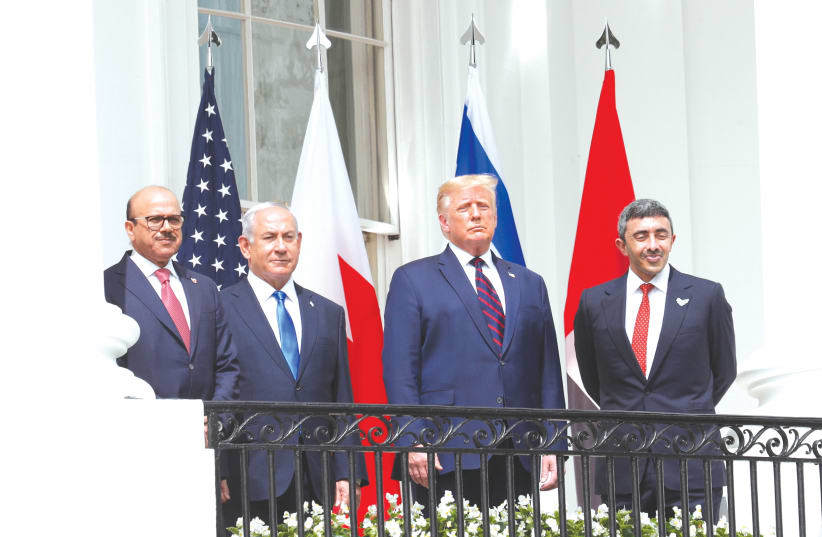 BAHRAIN’S FOREIGN MINISTER Abdullatif Al Zayani (left), Prime Minister Benjamin Netanyahu, US President Donald Trump and UAE Foreign Minister Abdullah bin Zayed gather on the balcony of the White House on Tuesday before the signing of the Abraham Accord.  (photo credit: TOM BRENNER/REUTERS)