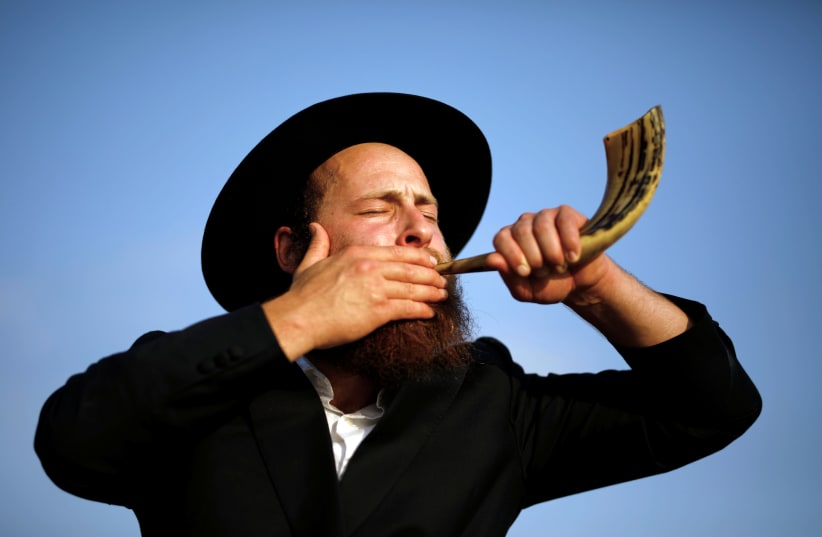 Why is the shofar blown during Elul? It forces the ‘ba’al tekiah’ to rehearse.  (photo credit: AMIR COHEN/REUTERS)