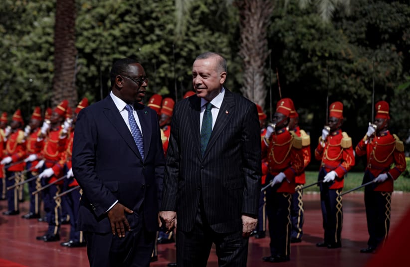 Senegal's President Macky Sall welcomes his Turkish counterpart Tayyip Erdogan at the presidential palace in Dakar, Senegal January 28, 2020 (photo credit: REUTERS/ZOHRA BENSEMRA)