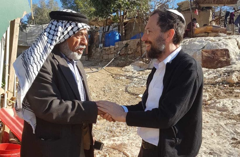 Rabbi Yakov Nagen on a visit with a neighbor in the Hebron hills (photo credit: EYAL SHANI)