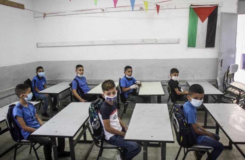 Palestinian students arrive to their first day of school in Nablus, West Bank ,on September 6, 2020. (photo credit: NASSER ISHTAYEH/FLASH90)