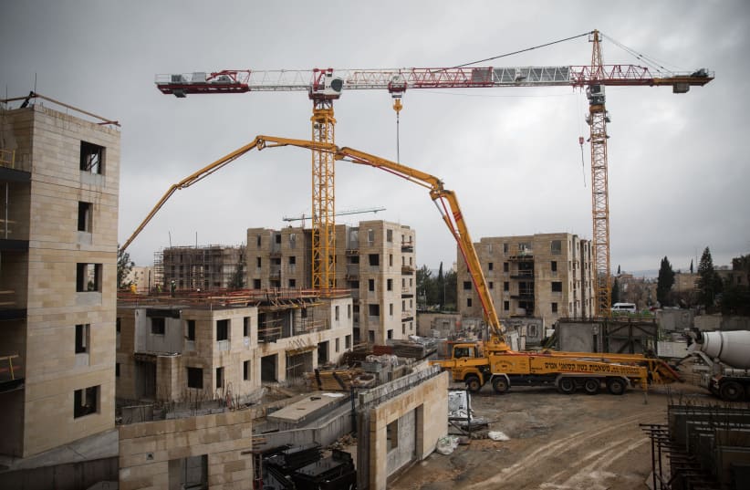 View of the construction site of 'Mechir Lamishtaken' at Armon Hanatziv neighborhood in Jerusalem on January 28, 2019. (photo credit: HADAS PARUSH/FLASH90)