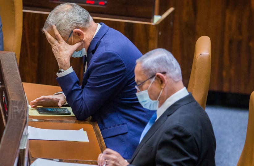 Alternate Prime Minister and Minister of Defense Benny Gantz and Israeli Prime Minister Benjamin Netanyahu seen during a vote at the Knesset, the Israeli parliament in Jerusalem on August 24, 2020. (photo credit: OREN BEN HAKOON/FLASH90)