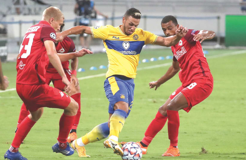 EYLON ALMOG (center) and Maccabi Tel Aviv put up a valiant effort against Red Bull Salzburg on Tuesday night, even taking a lead into the break, but the Austrian club pulled out a 2-1 away victory in the Champions League Playoff first leg at Bloomfield Stadium. (photo credit: REUTERS)