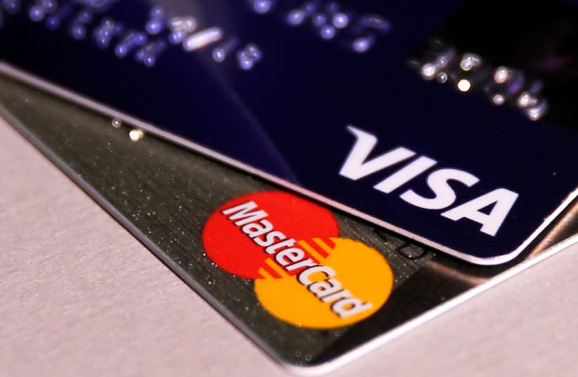 MasterCard and VISA credit cards are seen in this picture illustration taken June 9, 2016 (photo credit: MAXIM ZMEYEV/REUTERS)