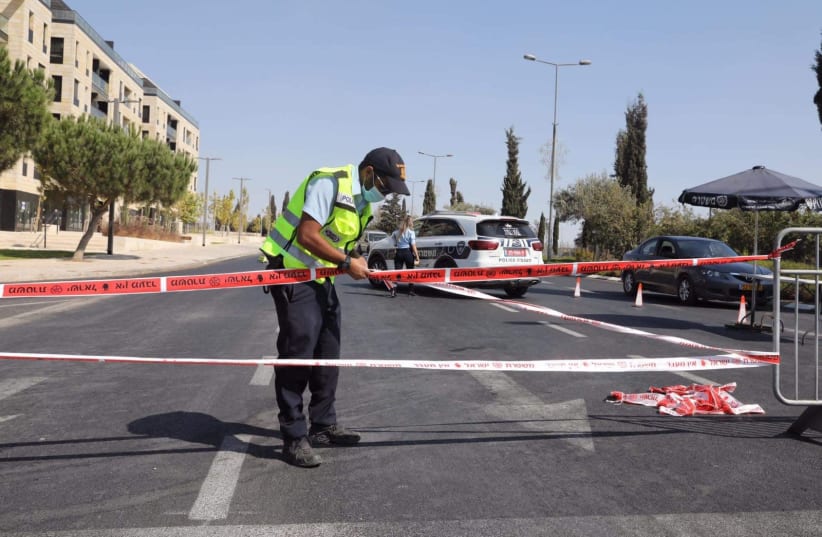 Police are seen setting up a checkpoint for drivers, during Israel's second lockdown, September 2020. (photo credit: MARC ISRAEL SELLEM)