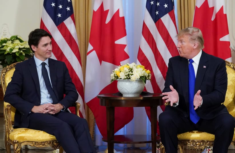 U.S. President Donald Trump and Canada's Prime Minister Justin Trudeau hold a meeting ahead of the NATO summit in Watford, in London, Britain, December 3, 2019 (photo credit: REUTERS/KEVIN LAMARQUE)