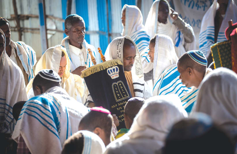 MEMBERS OF the Falash Mura community attend morning prayer services in the synagogue in Gondar, Ethiopia, in 2016.  (photo credit: MIRIAM ALSTER/FLASH90)