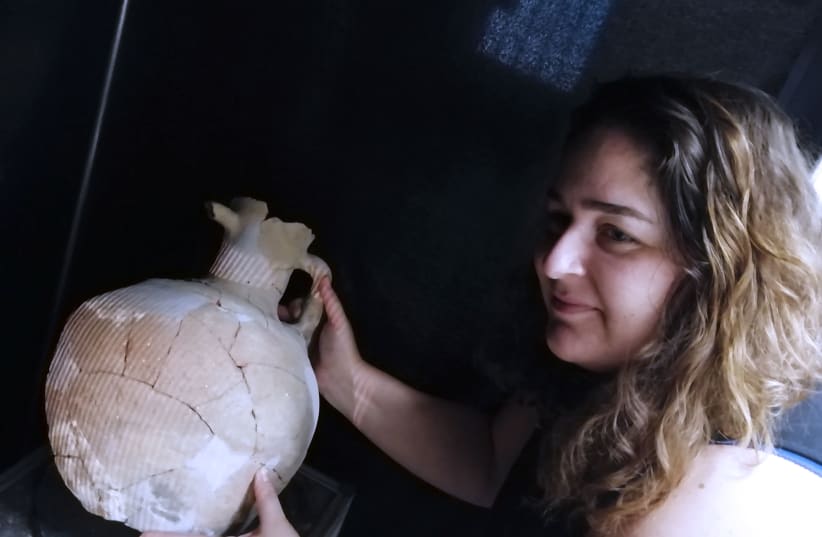 Ortal Harush with one of the Iron-Age jars found in Khirbet Qeiyafa (photo credit: HEBREW UNIVERSITY)