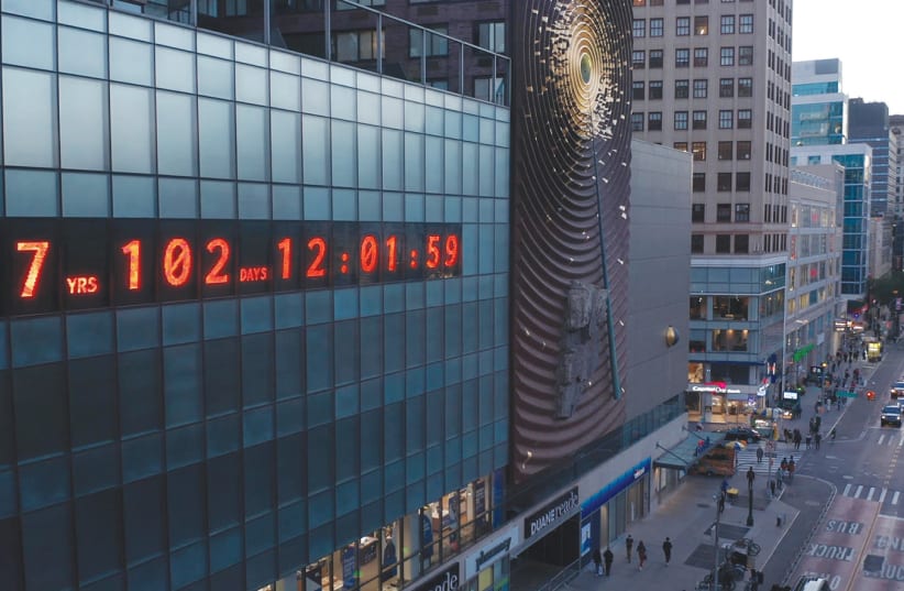 ON ROSH HASHANAH, the iconic Metronome clock in New York City was repurposed as an 80-foot-wide climate clock that shows our remaining time to take urgent action on climate change. (photo credit: BEN WOLF)