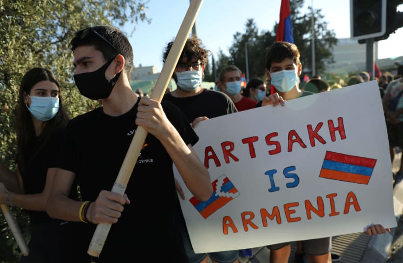People take part in a protest organized by the Armenian community living in Cyprus outside the American Embassy in Nicosia, Cyprus, September 30, 2020. (photo credit: REUTERS)