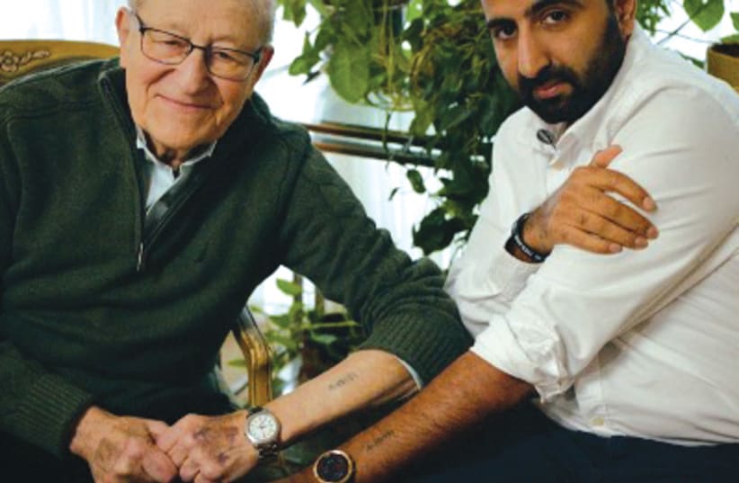 HOLOCAUST SURVIVOR Irving Roth and Muslim-turned-pro-Israel-activist Kasim Hafeez show their matching tattoos in ‘Never Again?’  (photo credit: Courtesy)