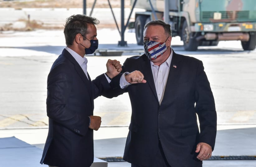 US Secretary of State Mike Pompeo and Greek Prime Minister Kyriakos Mitsotakis visit the Naval Support Activity base at Souda, Crete, Greece September 29, 2020. (photo credit: REUTERS)