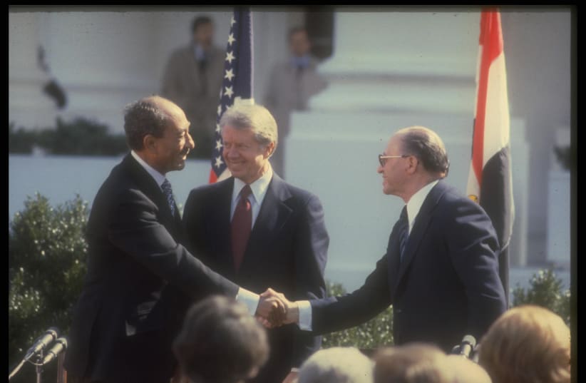 Anwar Sadat, Jimmy Carter and Menachem Begin at the signing of the Camp David Accords in 1979 (photo credit: GPO)