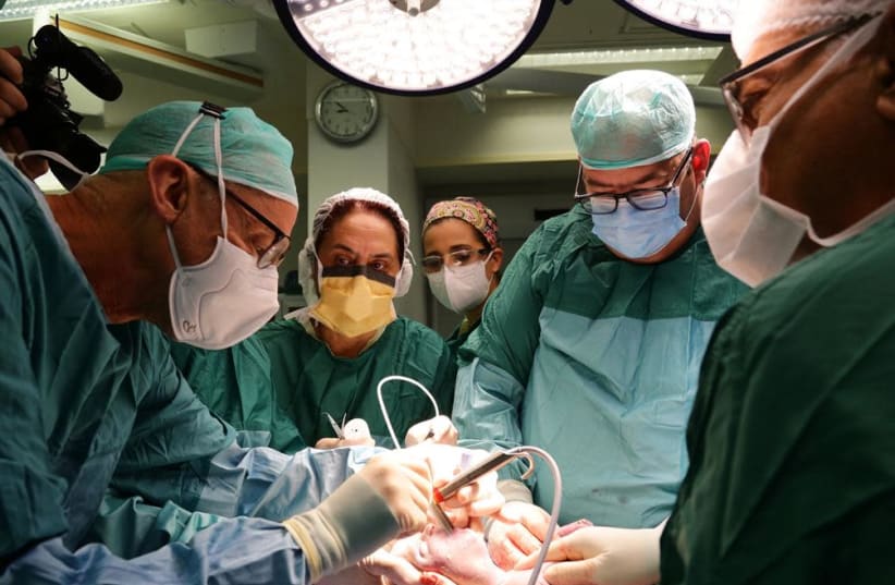 A newborn baby receiving life-saving surgery at chilov Medical Center in Tel Aviv. (photo credit: MIRI GATTENYO/ICHILOV SPOKESPERSON'S OFFICE)