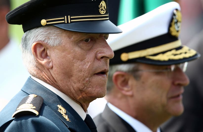 Mexico's Defense Minister General Salvador Cienfuegos and Secretary of the Navy Admiral Vidal Francisco Soberon take part in Flag Day celebrations at Campo Marte in Mexico City, Mexico February 24, 2018.  (photo credit: EDGARD GARRIDO/ REUTERS)