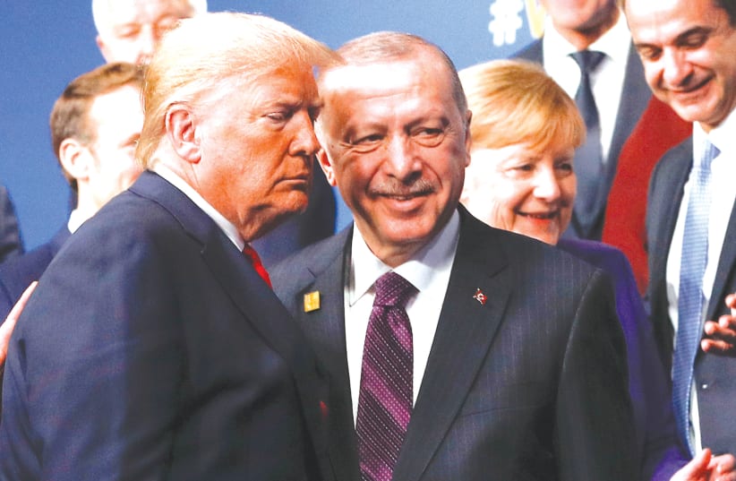 US President Donald Trump and Turkish President Recep Tayyip Erdogan meet during the annual NATO Heads of State and Government Summit in Watford, Britain, last year. (photo credit: PETER NICHOLLS/REUTERS)