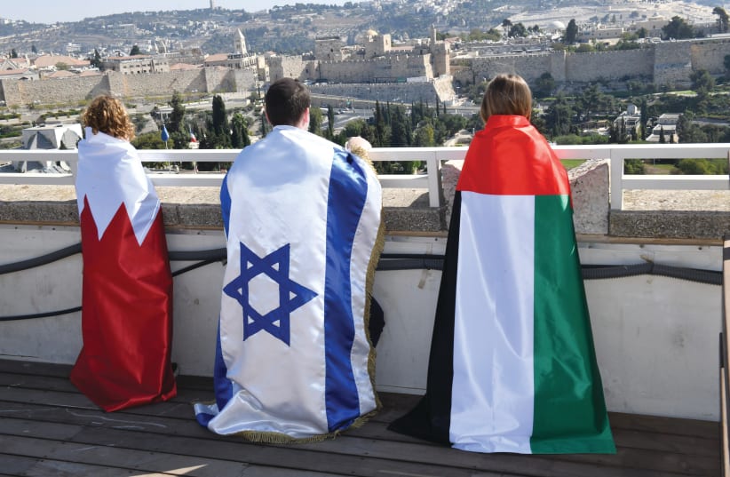The Gulf-Israel Women's Forum brings children draped in the flags of Bahrain, Israel and the UAE to Jerusalem's Old City.  (photo credit: ISRAEL HADARI)