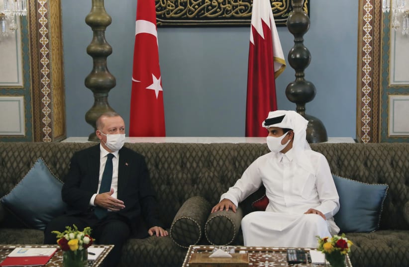 Turkish President Recep Tayyip Erdogan meets with Qatar Emir Sheikh Tamim bin Hamad al-Thani in Doha on October 7, 2020 (photo credit: TURKISH PRESIDENTIAL PRESS OFFICE/VIA REUTERS)