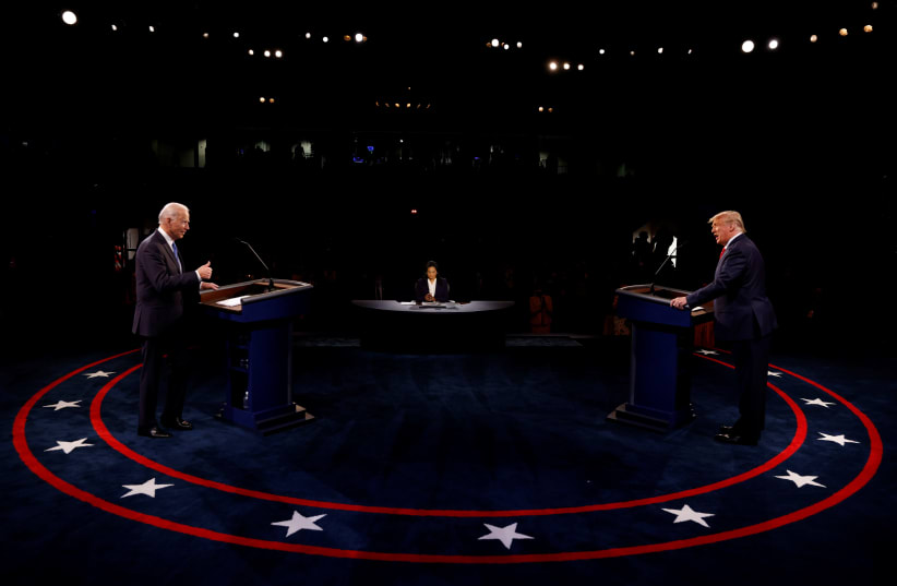President Trump and Democratic presidential nominee Biden participate in their second debate in Nashville (photo credit: REUTERS)