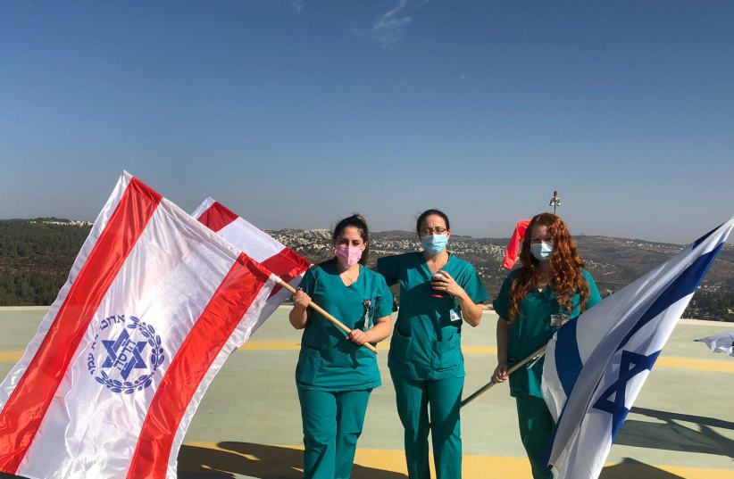 Hadassah Ein Kerem coronavirus department staff, on the roof of the hospital (photo credit: HADASSAH SPOKESPERSON)