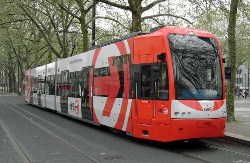 A light rail tram runs through Cologne, Germany (photo credit: Wikimedia Commons)